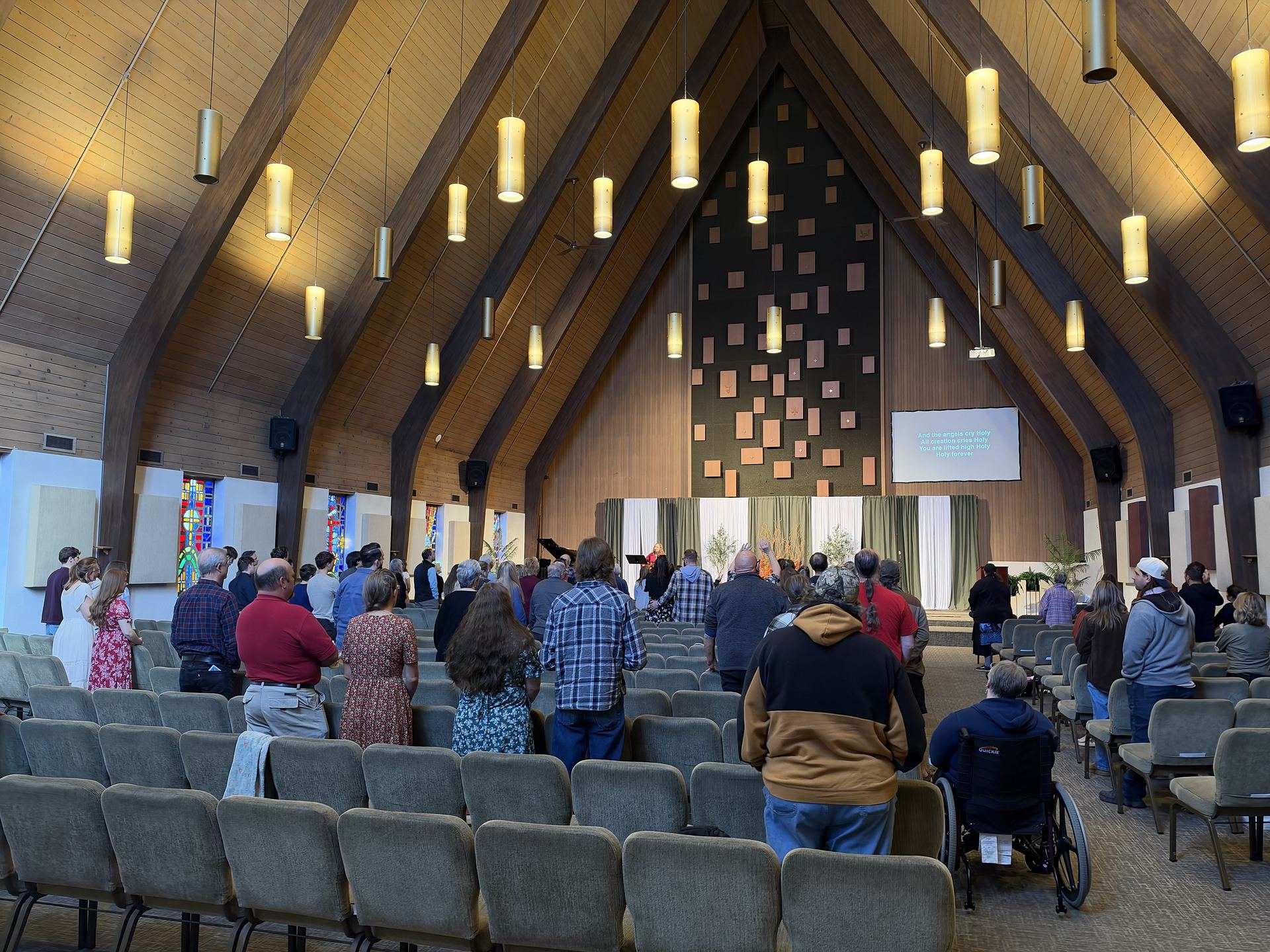 The congregation standing in worship on a Sunday morning at Calvary SonRise